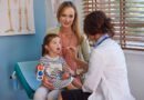 a dr checking a child